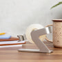 Side view of the silver tape dispenser showing the hook at the front
