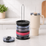 Vertical tumbler lid organizer on a kitchen counter holding a stack of lids beside a cream travel tumbler