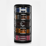 The belt organizer on a white background, five clear tiers holding navy, brown, black, tan and pink belts