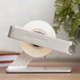 Silver ELYPRO tape dispenser holding a roll of clear tape on a wooden desk