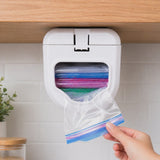 Three bags pulled one at a time from the ELYPRO ziplock bag dispenser mounted under a kitchen cabinet