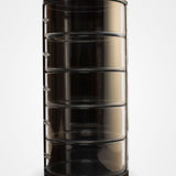 The empty belt organizer showing its five clear acrylic tiers and polished black back panel